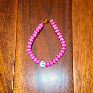 Pink braclet with smiley face